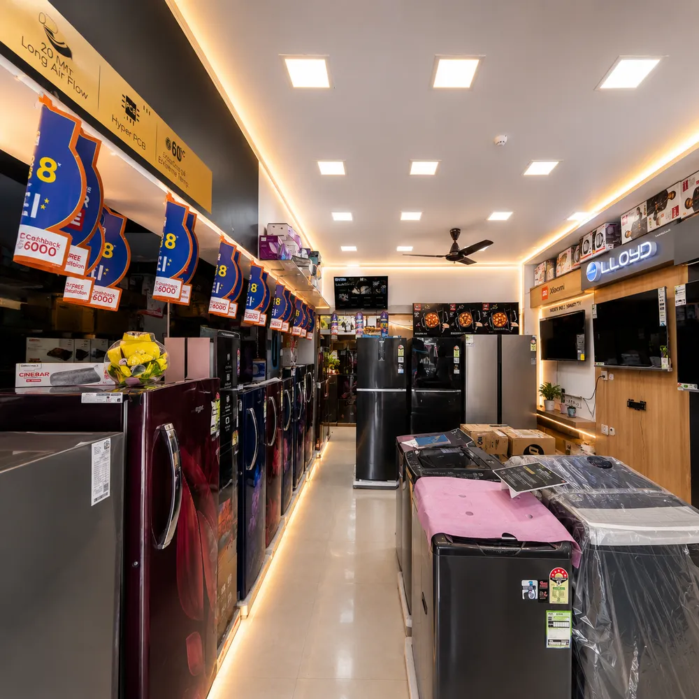 Refrigerators, washing machines and TVs on display inside the shop