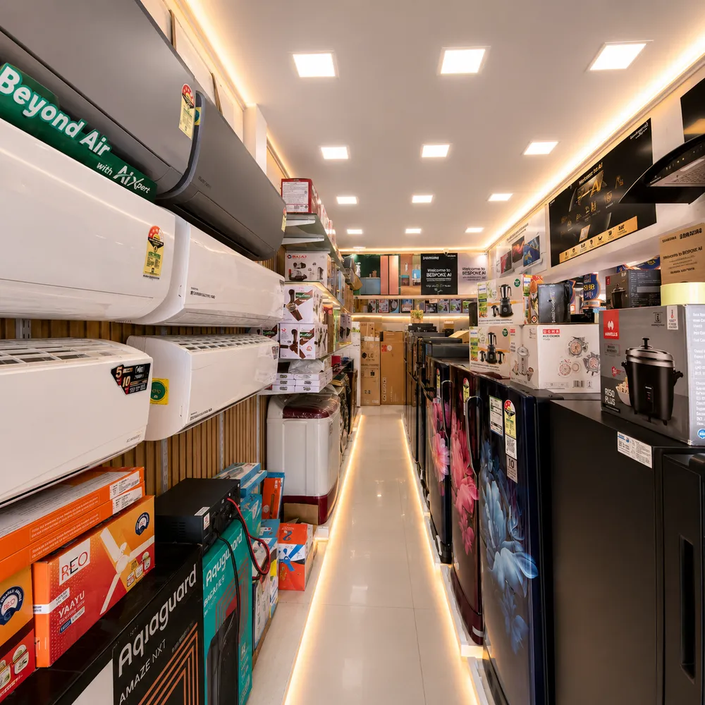 Air conditioners, refrigerators and appliances on display inside the shop